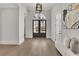 Grand foyer with light hardwood floors, decor, an arched doorway and plenty of natural light at 103 Candler Loop, Acworth, GA 30101