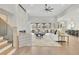 Spacious living room with fireplace, open layout, staircase and large windows overlooking backyard at 103 Candler Loop, Acworth, GA 30101