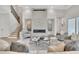 Cozy living room with a stone fireplace, plush seating, and plenty of natural light at 103 Candler Loop, Acworth, GA 30101