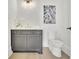 Modern powder room with gray vanity, white countertop, and sleek fixtures at 103 Candler Loop, Acworth, GA 30101