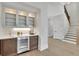 Entertainer's wet bar with custom cabinetry, beverage center, and under-cabinet lighting at 103 Candler Loop, Acworth, GA 30101