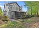 Beautiful backyard with screened-in porch, mature trees, and lush green lawn, perfect for outdoor living at 1363 Brentwood Ln, Marietta, GA 30062
