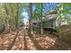 Wooded backyard with mature trees providing privacy and shade from the house at 1363 Brentwood Ln, Marietta, GA 30062
