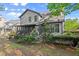 A spacious backyard featuring lush greenery, a screened-in porch, and plenty of shade at 1363 Brentwood Ln, Marietta, GA 30062