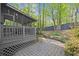 Charming screened-in porch overlooking landscaped backyard with mature trees and patio space at 1363 Brentwood Ln, Marietta, GA 30062