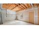 Unfinished basement with exposed wood beams and concrete foundation awaits customization at 1363 Brentwood Ln, Marietta, GA 30062