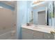 Light blue full bathroom featuring a vanity with storage and a shower-tub combo at 1363 Brentwood Ln, Marietta, GA 30062