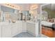 Primary bathroom featuring dual sink vanity, two mirrors, and access to bedroom at 1363 Brentwood Ln, Marietta, GA 30062