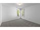 Bright bedroom featuring plush carpeting and two windows for natural light at 1363 Brentwood Ln, Marietta, GA 30062