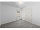 Neutral bedroom with a closet providing storage and gray carpeting at 1363 Brentwood Ln, Marietta, GA 30062