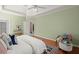 A bright bedroom offers hardwood floors and serene green walls at 1363 Brentwood Ln, Marietta, GA 30062