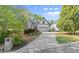 Well-manicured lawn and long driveway lead to this home with stone and stucco exterior features at 1363 Brentwood Ln, Marietta, GA 30062