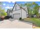 Well-maintained home featuring a two-car garage, manicured lawn, and a charming facade at 1363 Brentwood Ln, Marietta, GA 30062