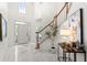 Elegant foyer featuring marble flooring, a staircase, and a stylish table with decor at 1363 Brentwood Ln, Marietta, GA 30062