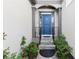 Inviting entryway with a stylish blue front door and decorative landscaping at 1363 Brentwood Ln, Marietta, GA 30062