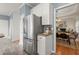 View of modern refrigerator and connecting spaces to kitchen and living areas at 1363 Brentwood Ln, Marietta, GA 30062