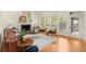 Cozy living room featuring a fireplace, hardwood floors and large windows at 1363 Brentwood Ln, Marietta, GA 30062