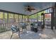 Relaxing screened porch with a ceiling fan and comfortable seating area at 1363 Brentwood Ln, Marietta, GA 30062