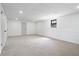 Finished basement features neutral carpet, white walls with wainscoting, and recessed lighting at 1612 Sky Crest Dr, Lithia Springs, GA 30122