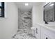 Modern bath showcasing walk-in shower, designer tile and double sink vanity at 1612 Sky Crest Dr, Lithia Springs, GA 30122