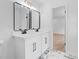 Modern bathroom features a double sink vanity, mirrors and marble floors at 1612 Sky Crest Dr, Lithia Springs, GA 30122