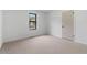 Bright bedroom with natural light, neutral carpet, and fresh paint at 1612 Sky Crest Dr, Lithia Springs, GA 30122
