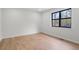 Bedroom with laminate flooring and a black-framed window looking outdoors at 1612 Sky Crest Dr, Lithia Springs, GA 30122