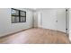 Spacious room with laminate flooring, a window, and white doors and trim at 1612 Sky Crest Dr, Lithia Springs, GA 30122