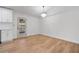 Bright dining area with wood floors, modern chandelier, and access to outdoor space at 1612 Sky Crest Dr, Lithia Springs, GA 30122