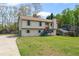 Inviting two-story home with a well-manicured lawn, attached garage, and charming curb appeal at 1612 Sky Crest Dr, Lithia Springs, GA 30122