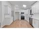 Modern kitchen with white cabinets, stainless steel appliances, and ample counter space at 1612 Sky Crest Dr, Lithia Springs, GA 30122