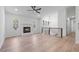 Bright open-concept living area featuring a fireplace, wood floors, and modern railings at 1612 Sky Crest Dr, Lithia Springs, GA 30122
