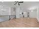 Open-concept living space showcasing wood floors and an adjacent, modern kitchen at 1612 Sky Crest Dr, Lithia Springs, GA 30122
