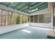 Relaxing sunroom featuring a ceiling fan and a full view of the beautiful trees at 1612 Sky Crest Dr, Lithia Springs, GA 30122
