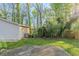 Scenic backyard view with lush greenery, mature trees, and partial house view at 2070 Perkerson Sw Rd, Atlanta, GA 30310