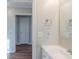 Bathroom featuring a modern vanity, white sink, and well-lit mirror at 2070 Perkerson Sw Rd, Atlanta, GA 30310