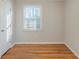Bright bedroom featuring hardwood floors and a window with natural light at 2070 Perkerson Sw Rd, Atlanta, GA 30310