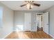 Bedroom with hardwood floors, ceiling fan, and ample natural light at 2070 Perkerson Sw Rd, Atlanta, GA 30310