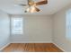 Bedroom featuring hardwood floors, a ceiling fan, and natural light from windows at 2070 Perkerson Sw Rd, Atlanta, GA 30310