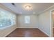 Bright bedroom featuring wood-look floors, crown molding, and plenty of natural light at 2070 Perkerson Sw Rd, Atlanta, GA 30310