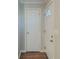 Bright entryway featuring wood-look flooring and a classic white door with glass accent at 2070 Perkerson Sw Rd, Atlanta, GA 30310