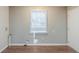Laundry area with wood-look flooring and natural light from a window at 2070 Perkerson Sw Rd, Atlanta, GA 30310