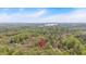 Scenic aerial view of the property surrounded by lush trees and greenery at 3640 Silver Leaf Sw Ln, Marietta, GA 30008