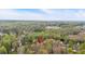 Scenic aerial view of the property surrounded by lush trees and greenery at 3640 Silver Leaf Sw Ln, Marietta, GA 30008