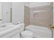 Clean bathroom with white fixtures, tiled shower-tub combo, and a modern design at 3640 Silver Leaf Sw Ln, Marietta, GA 30008