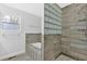 Modern bathroom featuring a tub, tiled shower, and frosted window for privacy at 3640 Silver Leaf Sw Ln, Marietta, GA 30008