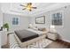 Staged bedroom showcasing a bed, modern decor, and ample natural light at 3640 Silver Leaf Sw Ln, Marietta, GA 30008