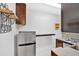 Efficient kitchen with stainless steel fridge, dark cabinetry and tiled countertops, offering a functional space at 3640 Silver Leaf Sw Ln, Marietta, GA 30008