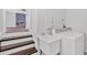 Functional laundry room with modern washer and dryer, adjacent to stairs and open living area at 3640 Silver Leaf Sw Ln, Marietta, GA 30008