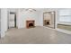 Spacious living room with a brick fireplace and ceiling fan, plus tile flooring and laundry in closet at 3640 Silver Leaf Sw Ln, Marietta, GA 30008